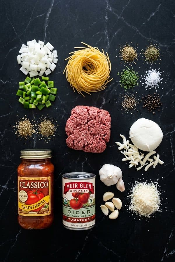 Easy Baked Spaghetti Casserole ingredients laid out on black marble countertop